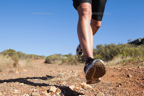 Athletic man jogging on country trail FYI00002496 Athletic man jogging on country trail FYI00002496