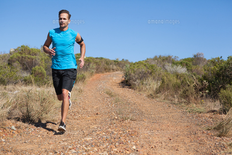 Athletic man jogging on country trail FYI00002497 Athletic man jogging on country trail FYI00002497