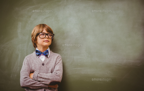 Boy with arms crossed looking up at blackboard FYI00006024 Boy with arms crossed looking up at blackboard FYI00006024