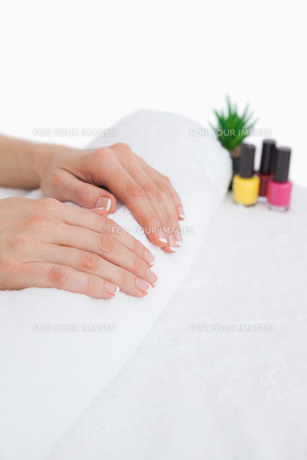 French manicured fingers and nail paint bottles FYI00488673 French manicured fingers and nail paint bottles FYI00488673